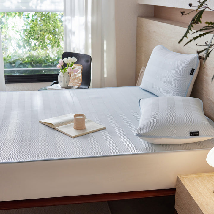 Breathable mattress topper with non-slip bottom and moisture-regulating structure