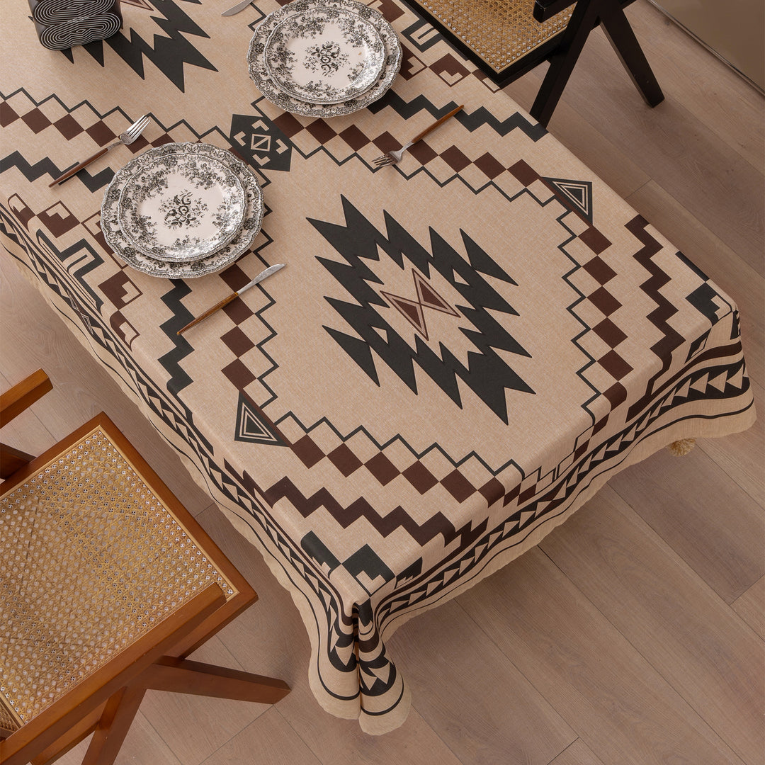 Woven tablecloth with ethnic Aztec pattern and pompom tassels
