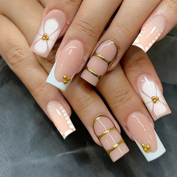 Artificial nail set with elegant gold embellishments and romantic accents Kalsten
