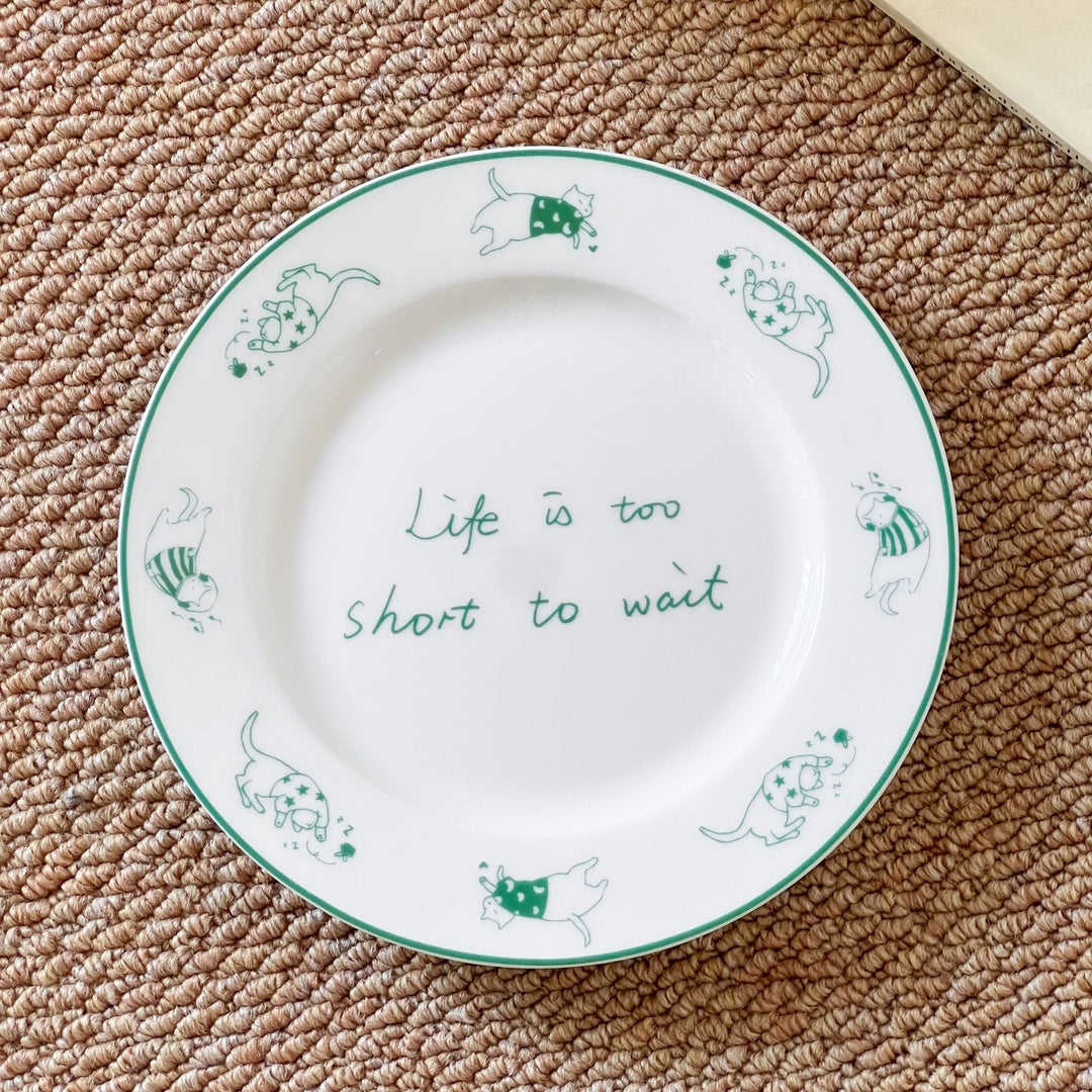 Handcrafted ceramic plate with illustrative cat design