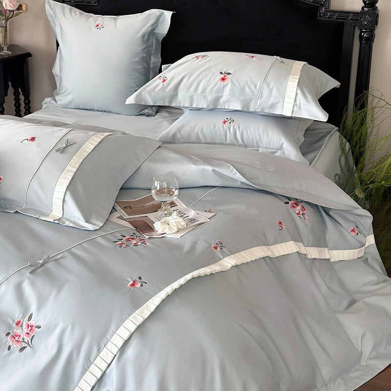 Elegant cotton satin bedding set with fine rose embroidery and pleated ruffle