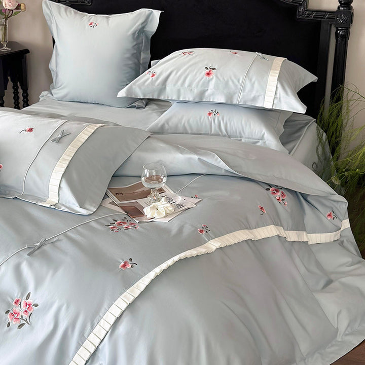 Elegant cotton satin bedding set with fine rose embroidery and pleated ruffle
