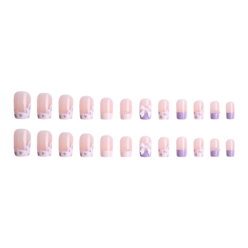Nail art set with elegant wave patterns and delicate pearl accents Kalsten