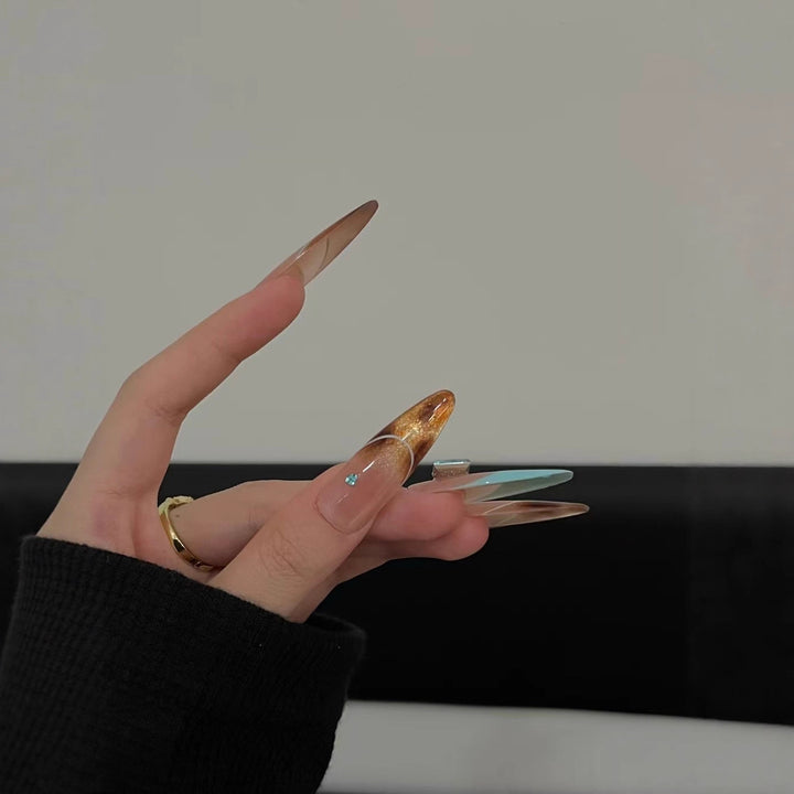 Elegant Stiletto Nail Extensions with Glitter Accents