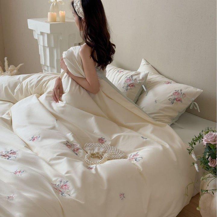 Luxurious cotton bedding set with delicate floral embroidery and reversible pillowcases