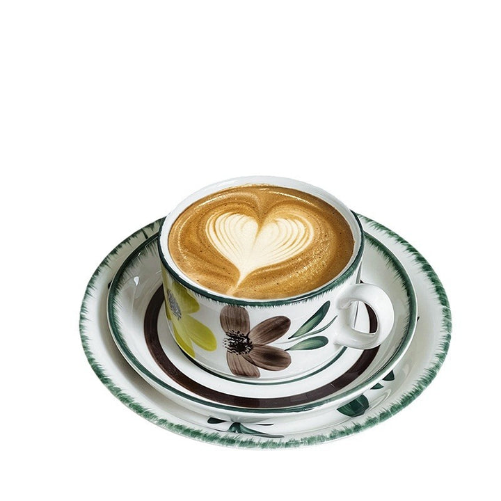 Porcelain cappuccino set with botanical brush painting and elegant rim decoration
