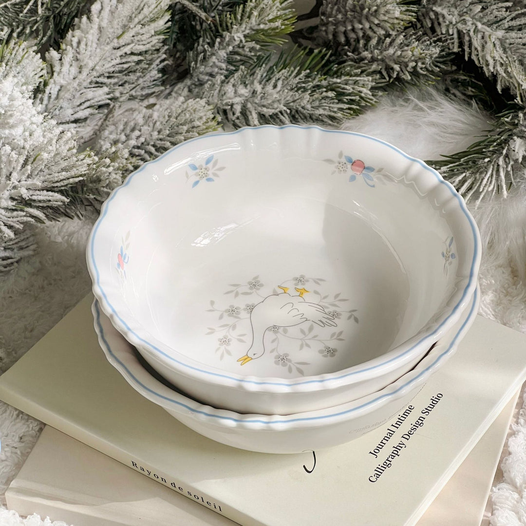 Decorative porcelain soup plate with ribbed edge and duck motif