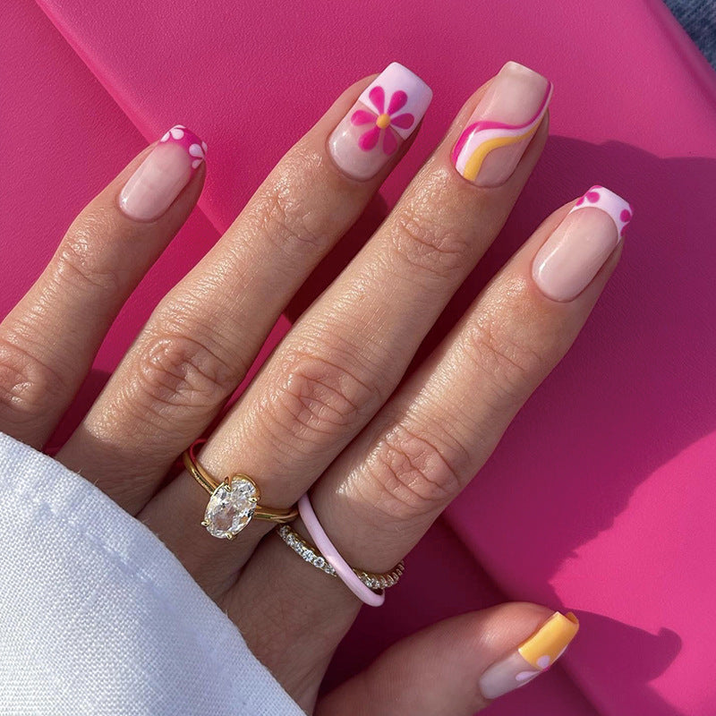 Creative Nail Art with Floral Design and Colorful Accents Kalsten