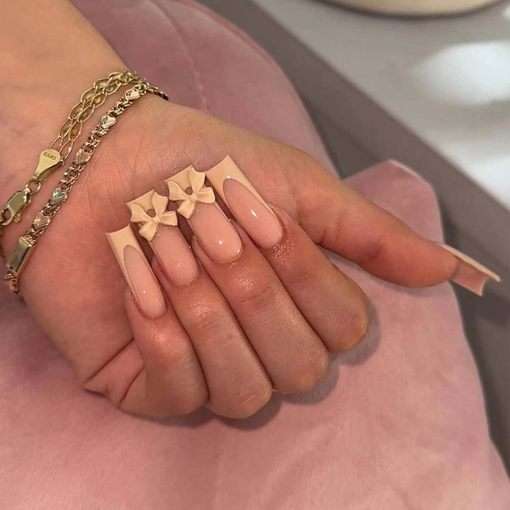 Artistic acrylic nails with bow decorations Kalsten