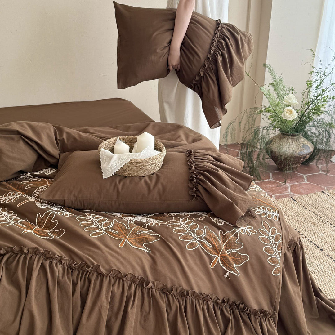 Bedding set with embroidered leaf pattern, ruffled bed skirt and ruffled pillow