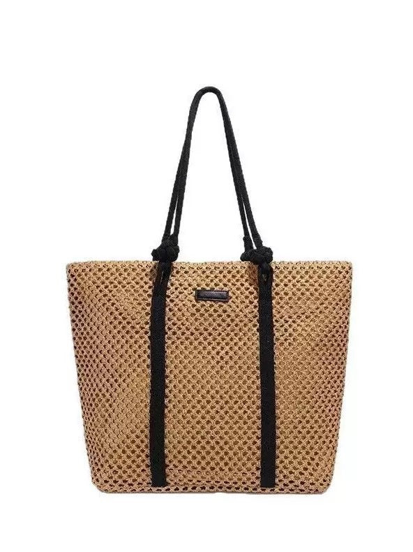 Beach bag made of hand-woven natural material with sturdy handles Kalsten