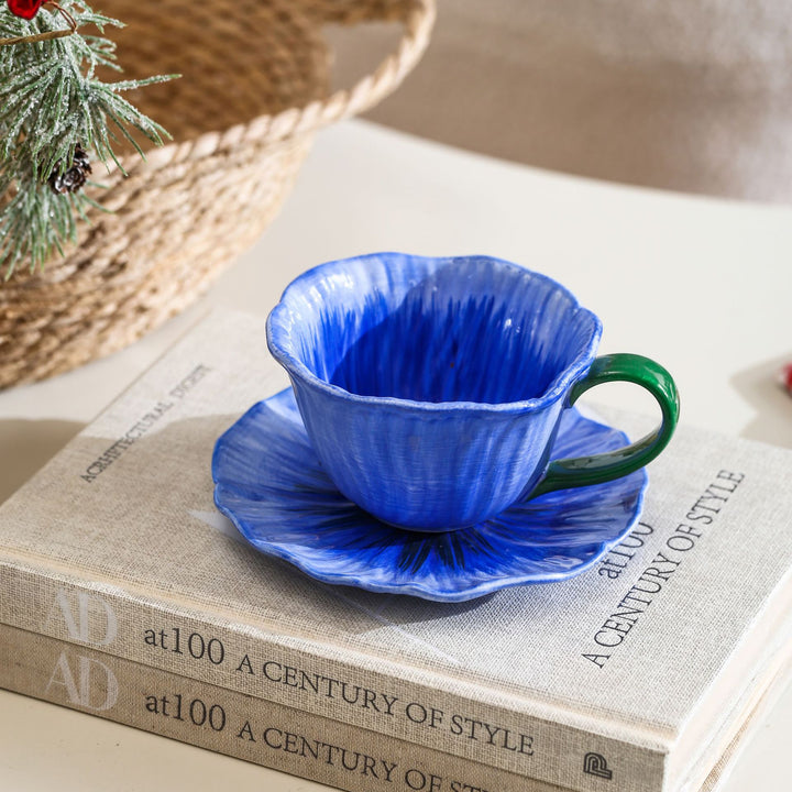 Ceramic mug with saucer in flower shape