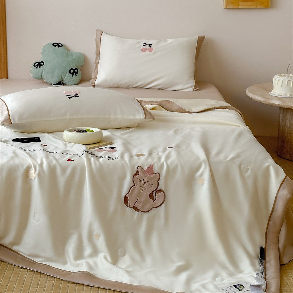 Satin bedding set with embroidered cat appliqués and silky soft finish
