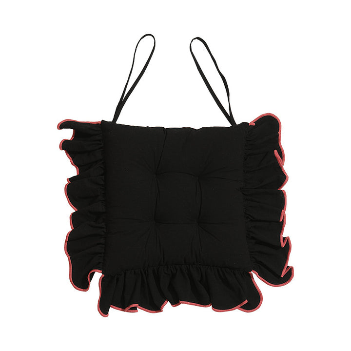 Padded chair cushion with ruffle and fastening bands