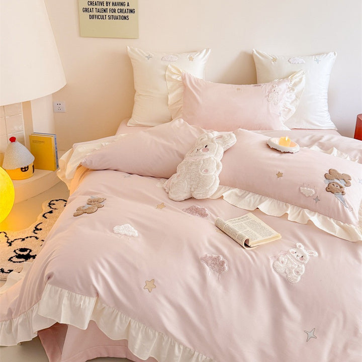 Romantic ruffle bedding set with embroidered teddy bear and cloud appliqués