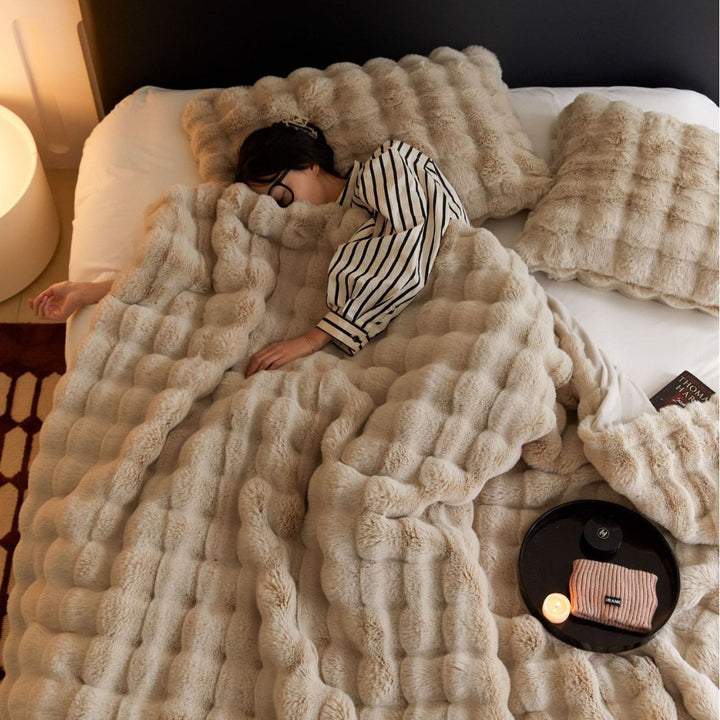 Cozy artificial fur throw blanket with wave structure and extra soft texture