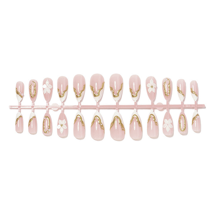 Artificial nail set with elegant gold accents and floral decorations Kalsten