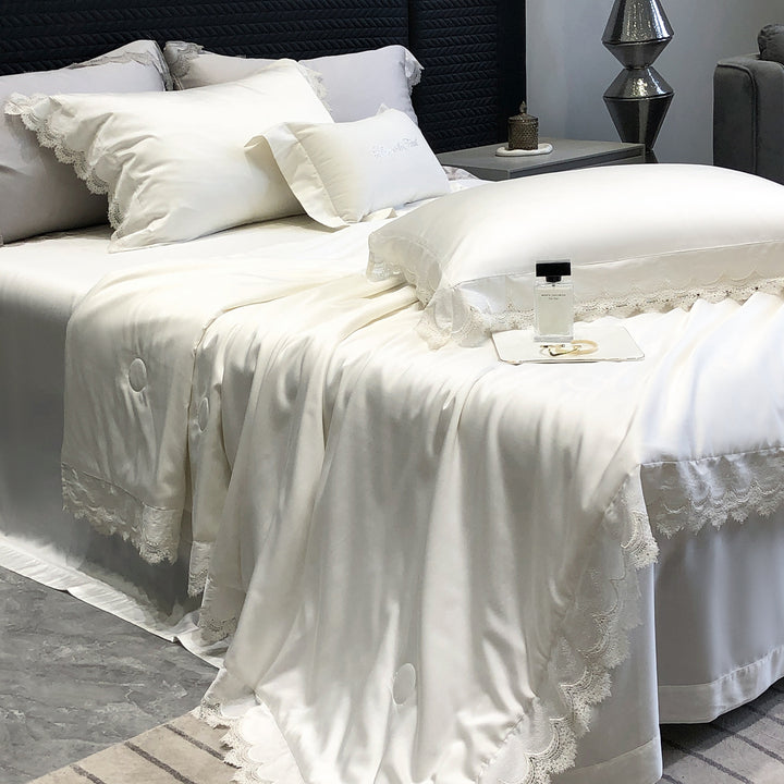 Elegant satin bedding set with lace trim and quilted bedspread