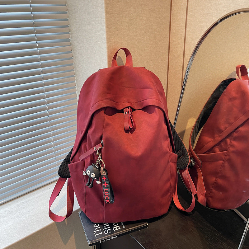 Fashionable backpack with practical design and decorative pendant Kalsten