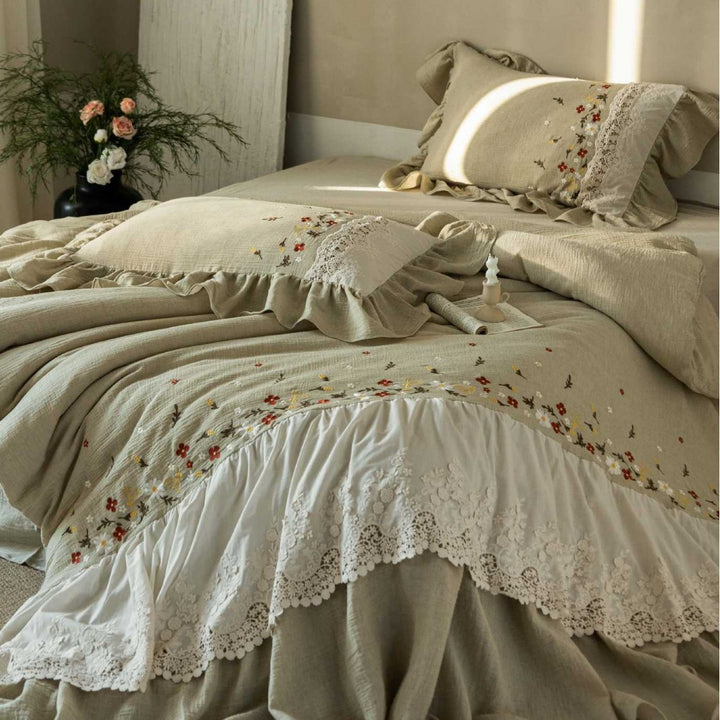 Romantic bedding set with lace bed skirt, embroidered floral decor and ruffle