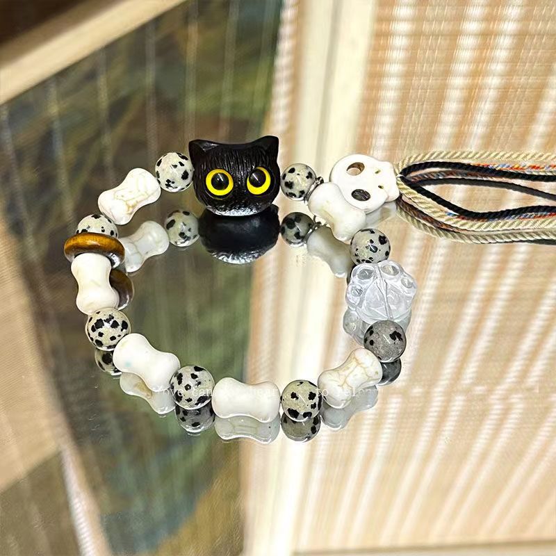 Whimsical Cat and Bone Charm Bracelet Kalsten