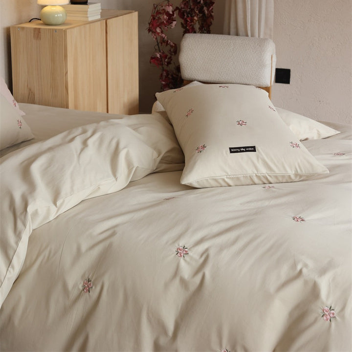 Embroidered cotton satin bedding set with subtle floral embroidery