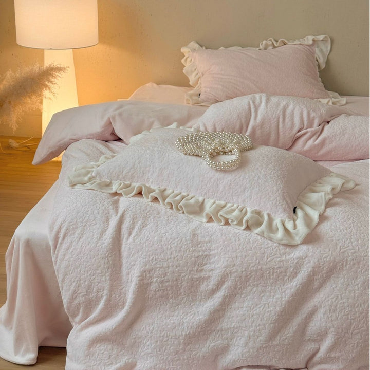 Bedding set with ruffle border and textured cotton blend