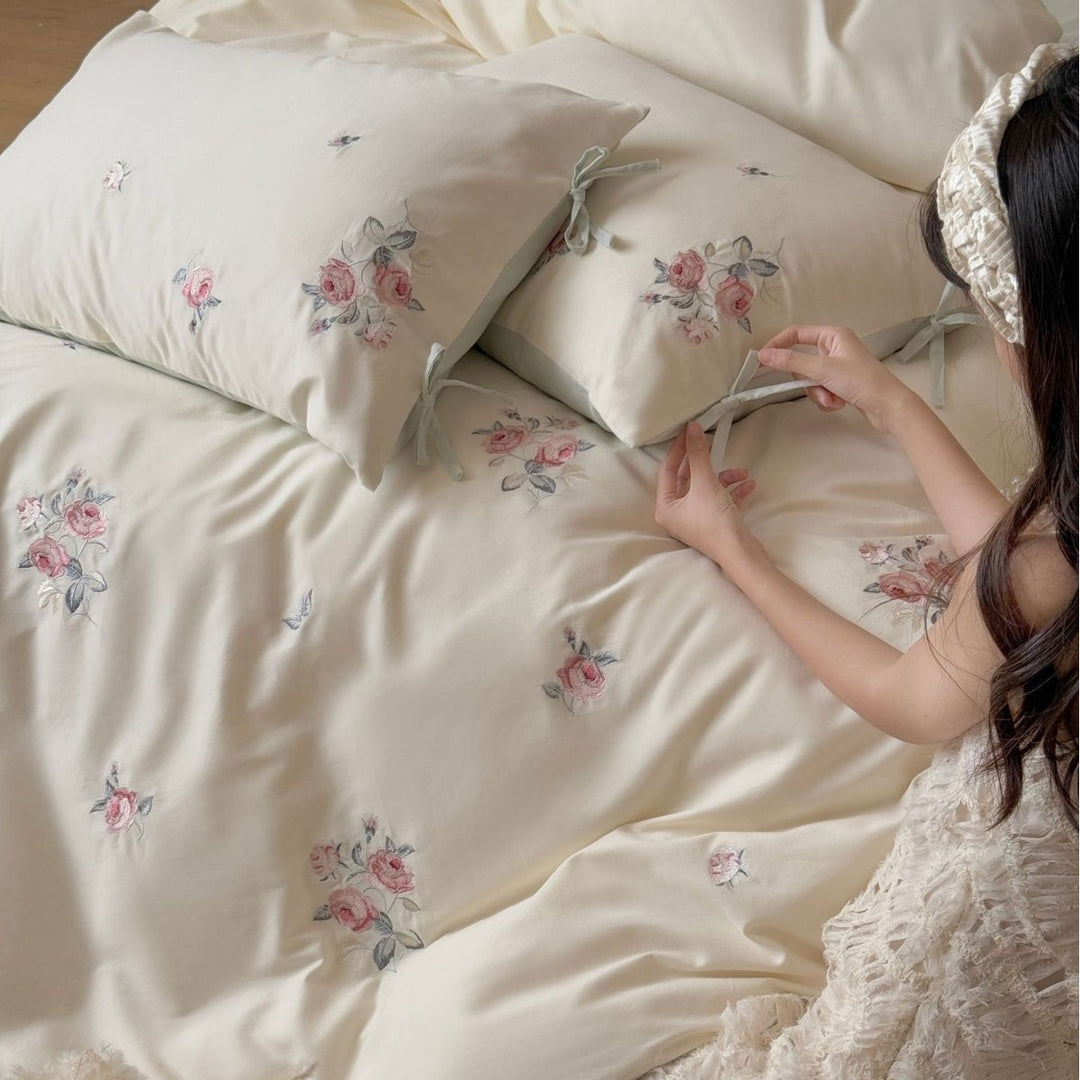 Luxurious cotton bedding set with delicate floral embroidery and reversible pillowcases