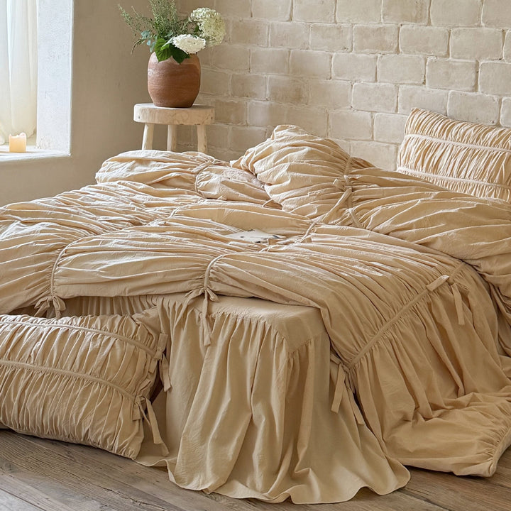 Luxurious gathered bedding set with ruffle, frills, and ties