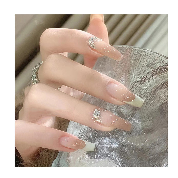 Artful stiletto nails with rhinestone accents Kalsten