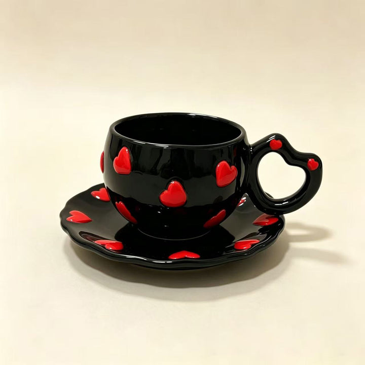 Porcelain cup set with heart-shaped handle and embossed decorative hearts