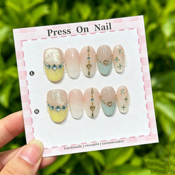 Artistic Press-On Nail Set with Heart and Gem Accents