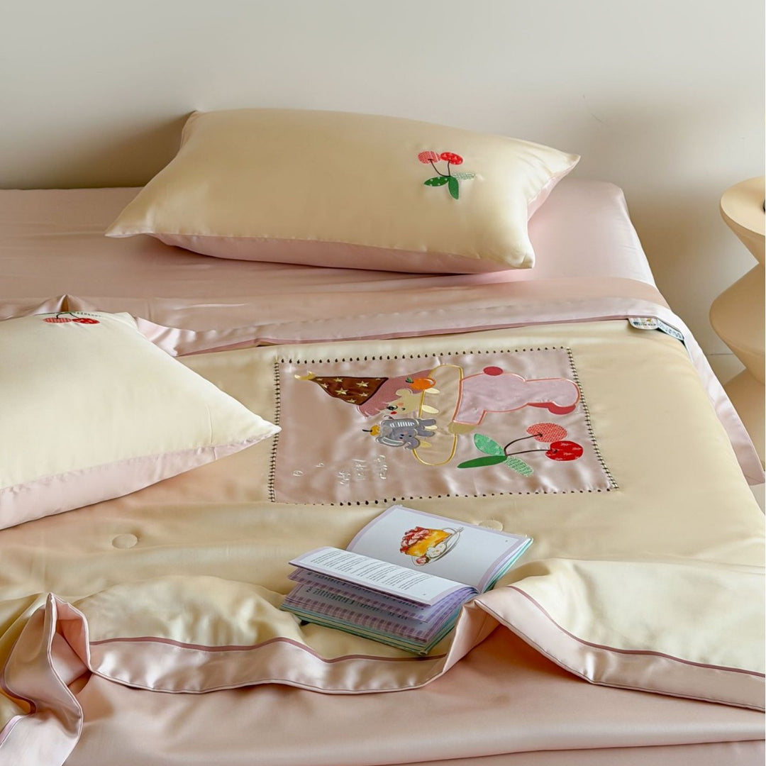 Satin bedding set with embroidered cat appliqués and silky soft finish