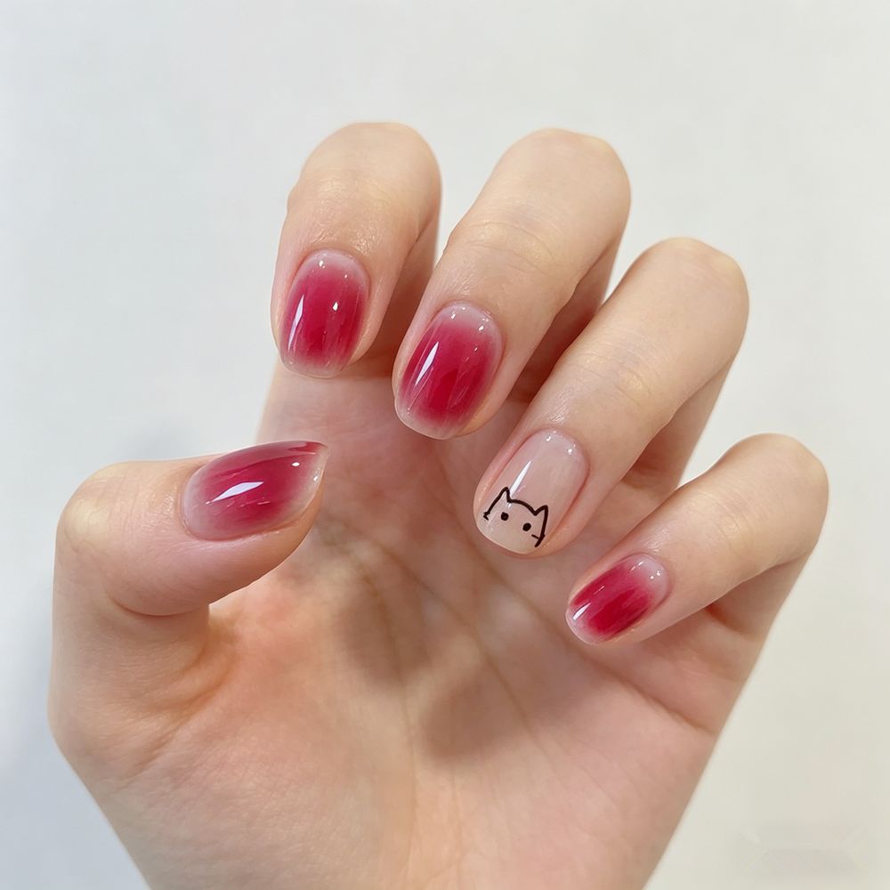 Artificial nails with elegant ombre effect and playful cat design Kalsten