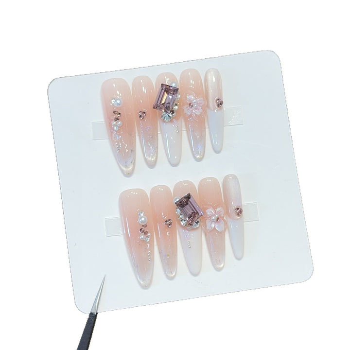 Artificial nails with elegant jewelry details Kalsten