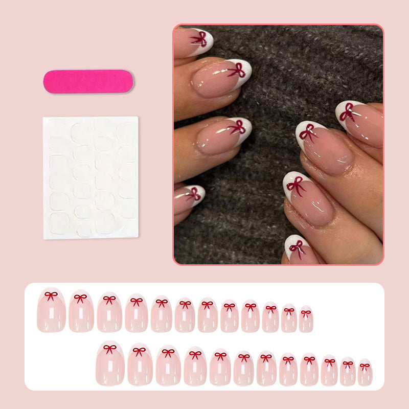 Artificial nail set with romantic bow motifs and French design Kalsten