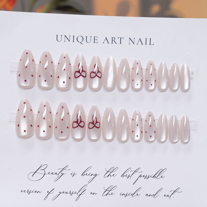 Elegant Stiletto Press-On Nail Art with Minimalist Bow Design