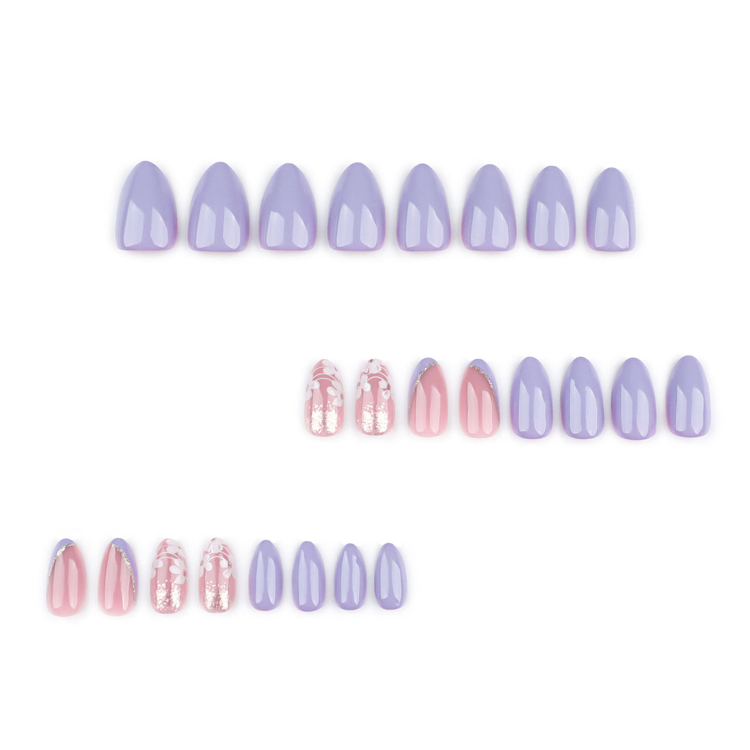 Artistic nail art with floral accents and glitter kalsten