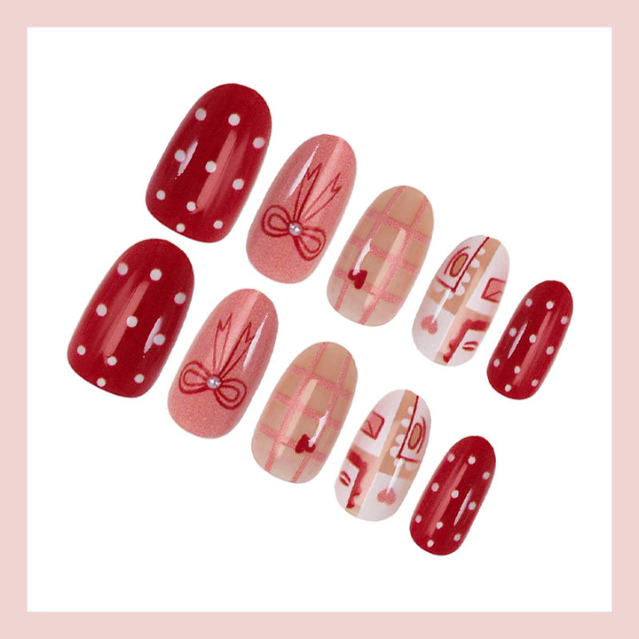 Artificial nail set with charming heart and bow patterns Kalsten