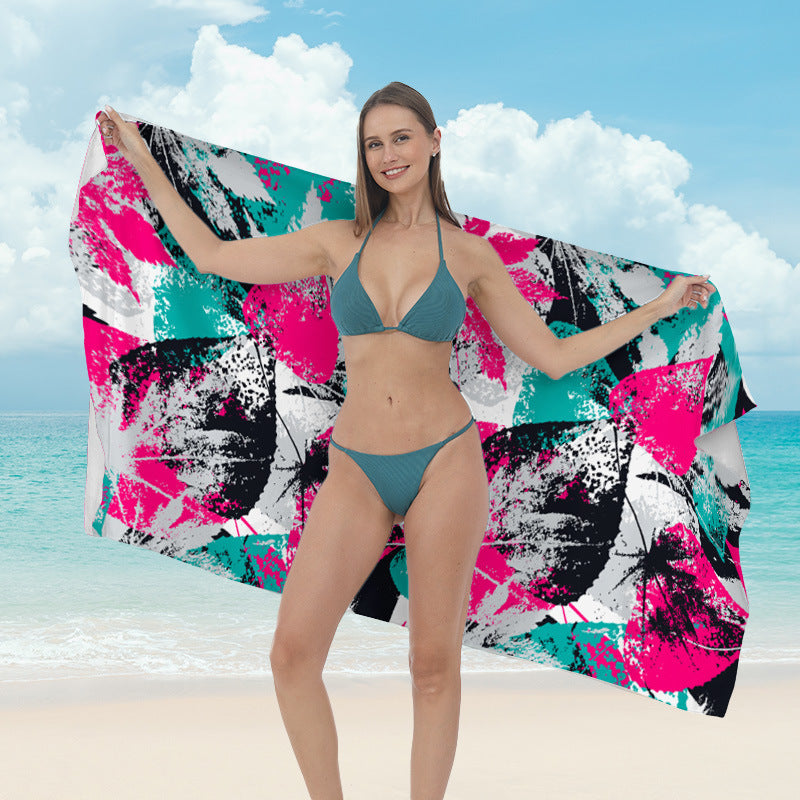 Beach towel with vibrant tropical plant motif Kalsten
