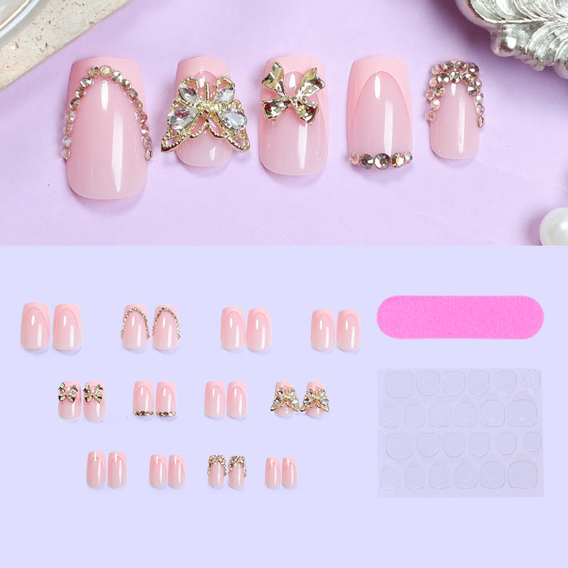 Glamorous artificial nail set with floral accents and glitter decorations Kalsten