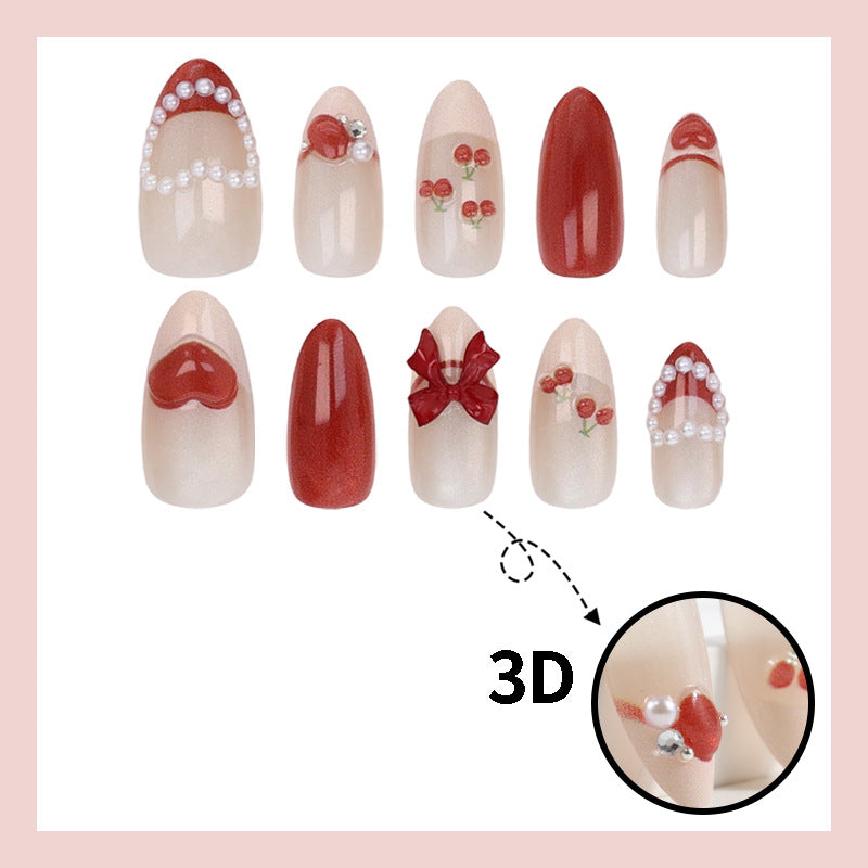 Artificial nail set with romantic berry designs and glamorous embellishments Kalsten