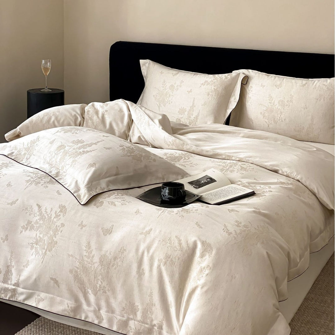 Finely woven cotton percale bedding set with subtle jacquard structure and contrast piping