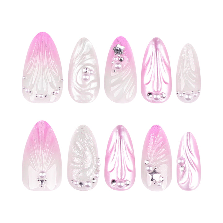 Artificial nail art with elegant swirl design and pearl embellishments Kalsten