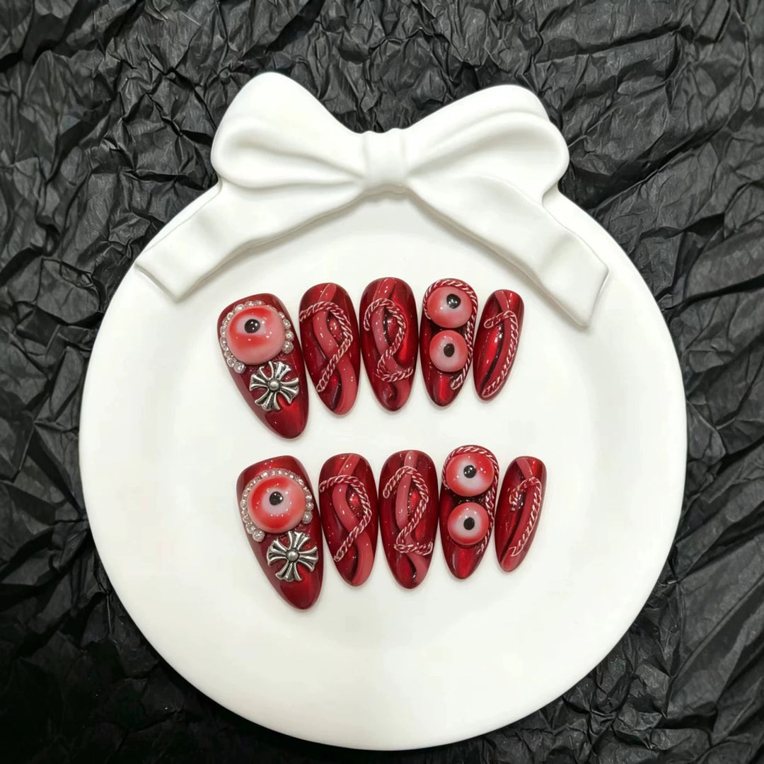 Artistic Press-On Nail Art Set with Unique Red Designs