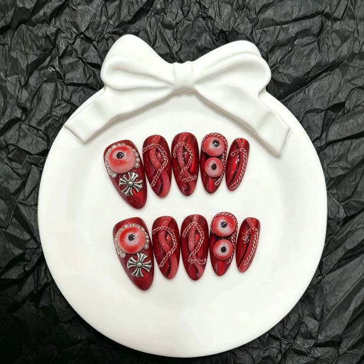 Artistic Press-On Nail Art Set with Unique Red Designs