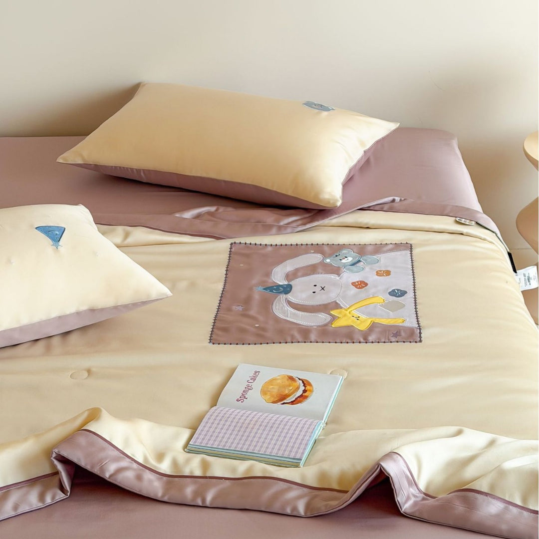 Satin bedding set with embroidered cat appliqués and silky soft finish