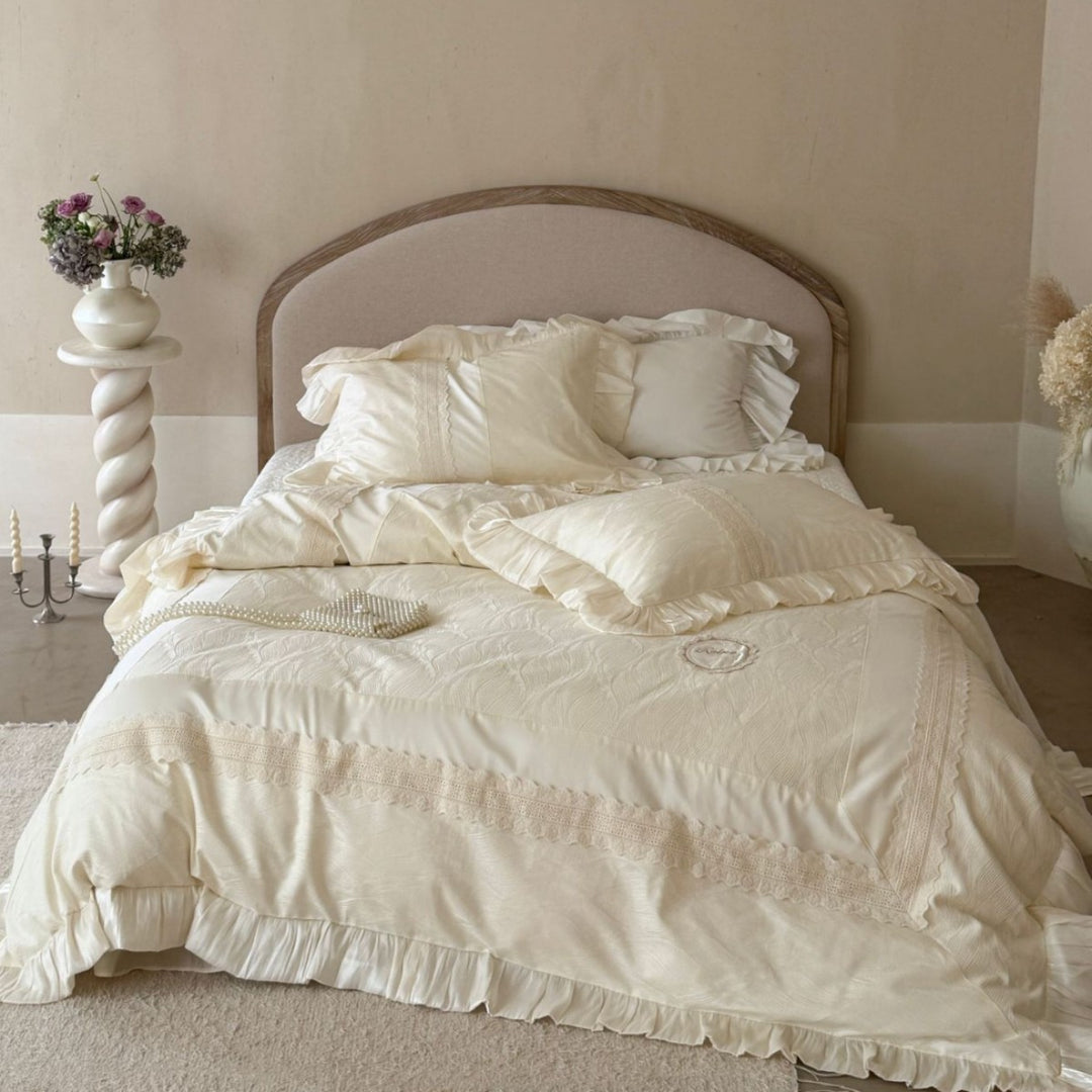 Duvet cover set with ruffle trim, fine lace border, and subtle jacquard structure