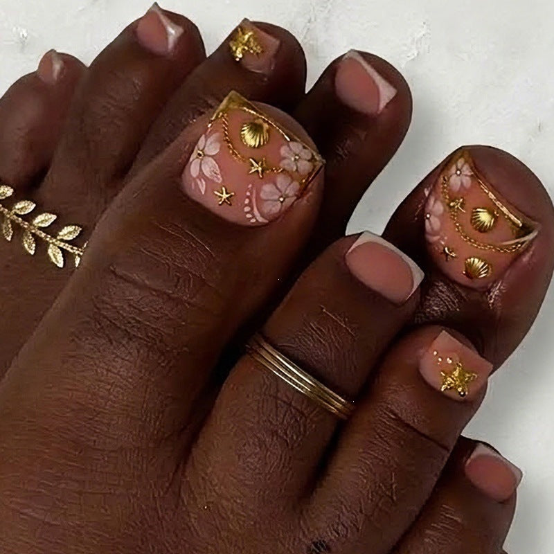 Acrylic nail set with exquisite floral accents and golden embellishments Kalsten
