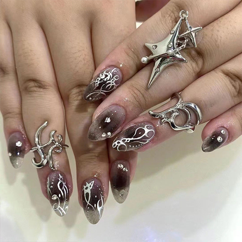 Artistic gel nails with delicate ornaments and glitter Kalsten